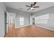Bright bedroom with hardwood floors, neutral walls, and multiple doorways for easy access at 2955 Mt Pleasant Rd, Willow Springs, NC 27592