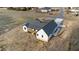 New construction white farmhouse with black trim, long driveway and asphalt roof at 2955 Mt Pleasant Rd, Willow Springs, NC 27592