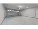 Spacious garage with concrete floor and automatic door at 2955 Mt Pleasant Rd, Willow Springs, NC 27592