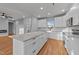 Bright, modern kitchen with a large island, white cabinets, and granite countertops at 2955 Mt Pleasant Rd, Willow Springs, NC 27592