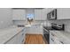 A well-appointed kitchen featuring white cabinets, granite countertops, and stainless steel appliances at 2955 Mt Pleasant Rd, Willow Springs, NC 27592