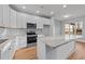 Well-lit kitchen with white cabinets, stainless steel appliances, and granite countertops at 2955 Mt Pleasant Rd, Willow Springs, NC 27592