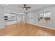 A bright living room area showcases wood floors and large windows for natural light at 2955 Mt Pleasant Rd, Willow Springs, NC 27592