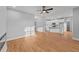 Open floor plan with wood flooring and a view of the modern kitchen with stainless steel appliances at 2955 Mt Pleasant Rd, Willow Springs, NC 27592