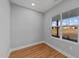 Light and airy home office featuring a large window, light gray walls, and wood-look floors at 2955 Mt Pleasant Rd, Willow Springs, NC 27592