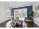 Bright dining area with natural light and an elegant chandelier at 308 Harmony Creek Pl, Apex, NC 27539