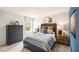 A bedroom featuring a decorative window shade and a large dark-stained wood dresser at 322 Umstead St, Sanford, NC 27330