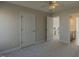 Bedroom showcasing neutral walls, soft carpet, and convenient access to a bathroom at 3671 Coach Lantern Ave, Wake Forest, NC 27587