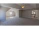 Large bedroom with neutral carpet, tray ceiling, and ample natural light at 3671 Coach Lantern Ave, Wake Forest, NC 27587