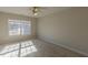 Bedroom featuring a large window providing natural light and cozy carpeted floors at 3671 Coach Lantern Ave, Wake Forest, NC 27587