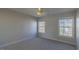 Bright bedroom featuring neutral walls, plush carpet, two windows and a ceiling fan with light at 3671 Coach Lantern Ave, Wake Forest, NC 27587