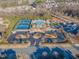 Aerial shot showcasing community amenities: pool, tennis courts, clubhouse, and ample parking at 3671 Coach Lantern Ave, Wake Forest, NC 27587