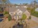 Beautiful two-story home featuring manicured landscaping, a cozy front porch, and brick and siding accents at 3671 Coach Lantern Ave, Wake Forest, NC 27587