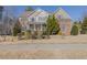 Charming two-story home with a well-manicured front yard and inviting front porch at 3671 Coach Lantern Ave, Wake Forest, NC 27587