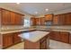 Well-equipped kitchen features ample cabinet space, stainless steel appliances, and a central island at 3671 Coach Lantern Ave, Wake Forest, NC 27587