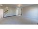Expansive living room with neutral walls, plush carpet, and staircase at 3671 Coach Lantern Ave, Wake Forest, NC 27587