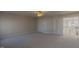 Open living area with neutral walls, plush carpet, and an open hallway at 3671 Coach Lantern Ave, Wake Forest, NC 27587