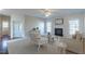 Bright living room with a fireplace, large windows, and plush carpet at 3671 Coach Lantern Ave, Wake Forest, NC 27587