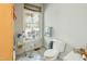 Cozy bathroom featuring a toilet and window, offering natural light and a view at 41 E T Hanner Rd, Bear Creek, NC 27207