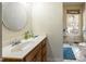 Bathroom has a white countertop sink and a window providing natural light and ventilation at 41 E T Hanner Rd, Bear Creek, NC 27207