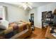 Bedroom featuring a bed with a patchwork quilt, hardwood floors, and a window at 41 E T Hanner Rd, Bear Creek, NC 27207