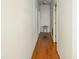 Hallway boasts gleaming hardwood floors and natural lighting at 41 E T Hanner Rd, Bear Creek, NC 27207