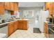 Functional kitchen features a double basin sink, ample cabinet storage, and view to breakfast nook at 41 E T Hanner Rd, Bear Creek, NC 27207