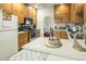 Bright kitchen with light wood cabinets, ample counter space, and a view to dining area at 41 E T Hanner Rd, Bear Creek, NC 27207