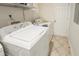 Functional laundry room with a washing machine and tiled floors at 41 E T Hanner Rd, Bear Creek, NC 27207
