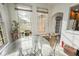 Cozy sunroom with ample natural light and a view to the backyard at 41 E T Hanner Rd, Bear Creek, NC 27207