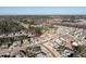 Aerial view showcases a residential neighborhood, highlighting a pond, community pool, landscaping, and well-maintained homes at 429 Teague St, Wake Forest, NC 27587