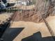 Aerial view of a fenced backyard with tall, bare trees and a brown lawn at 429 Teague St, Wake Forest, NC 27587