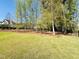 View of the backyard with nice lawn at 429 Teague St, Wake Forest, NC 27587