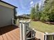 Outdoor deck with steps leading down to a lush and well-manicured backyard with a fence at 429 Teague St, Wake Forest, NC 27587