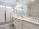 Modern bathroom featuring a glass shower, double vanity, and bright finishes at 429 Teague St, Wake Forest, NC 27587