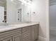 Bathroom with quartz countertops, double sinks, and modern fixtures at 429 Teague St, Wake Forest, NC 27587
