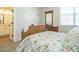 Bedroom featuring a bed with a patterned quilt, a dresser with mirror, and an ensuite bath at 429 Teague St, Wake Forest, NC 27587