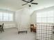 Bonus room area featuring vaulted ceilings, natural light, bench, and comfortable seating at 429 Teague St, Wake Forest, NC 27587