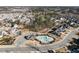 An aerial view showcases a community pool, highlighting a pool area with surrounding landscaping at 429 Teague St, Wake Forest, NC 27587