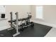 Home gym equipped with weightlifting bench and exercise bike, offering convenience for fitness enthusiasts at 429 Teague St, Wake Forest, NC 27587