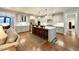 Bright, open kitchen featuring a large island, stainless steel appliances, and hardwood floors at 429 Teague St, Wake Forest, NC 27587