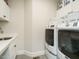 Functional laundry room with sink and newer appliances at 429 Teague St, Wake Forest, NC 27587