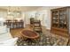 Cozy living room with hardwood floors, a leather armchair, and an open floor plan at 429 Teague St, Wake Forest, NC 27587