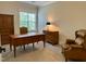 Home office space with wood furnishings, a large window, and a comfortable chair at 429 Teague St, Wake Forest, NC 27587
