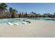 Community pool featuring shallow sun-bathing lounges, lap pool, splash pad, and lounge seating at 429 Teague St, Wake Forest, NC 27587