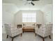 Cozy sitting room with a neutral color palette, comfortable seating, and a bright window at 429 Teague St, Wake Forest, NC 27587