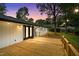 Spacious wooden deck with stylish lighting, perfect for outdoor entertaining and relaxation at 4705 Bernie Pl, Raleigh, NC 27616