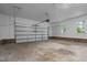 Spacious two-car garage with windows and automatic door, perfect for storage and vehicle protection at 4705 Bernie Pl, Raleigh, NC 27616