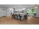 Kitchen island featuring stone countertops and seating for six at 4705 Bernie Pl, Raleigh, NC 27616