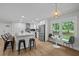 Kitchen with stainless appliances, central island and seating for six at 4705 Bernie Pl, Raleigh, NC 27616